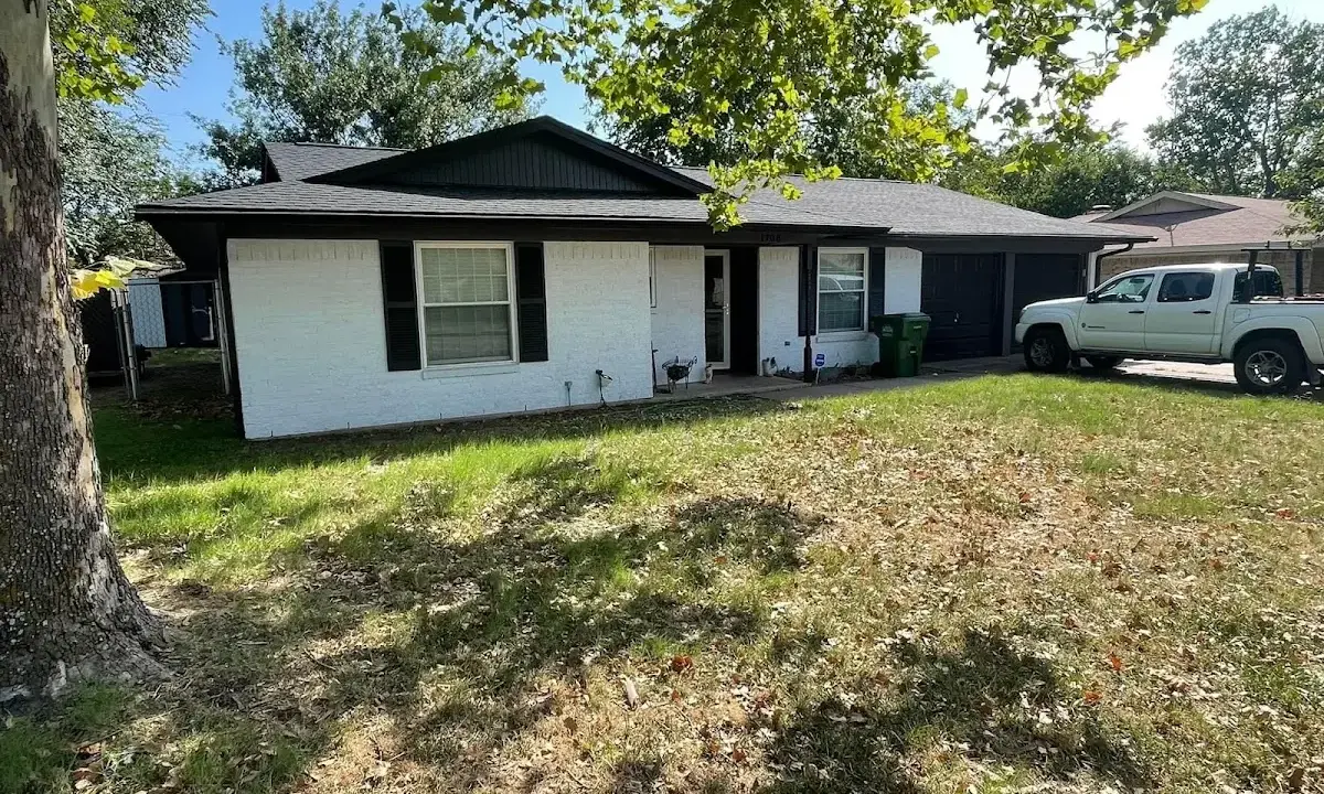 Professional roofing crew working on a residential roof in Conshohocken